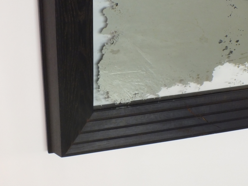 A reclaimed silver-backed mirror, preserved and framed in hand-ebonised oak. A bold, one-of-a-kind wall piece crafted with care, character, and a metal attitude.