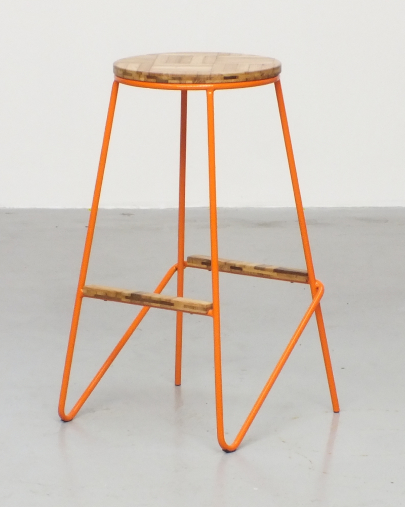 a one-of-a-kind high stool crafted from salvaged steel and reclaimed oak parquet